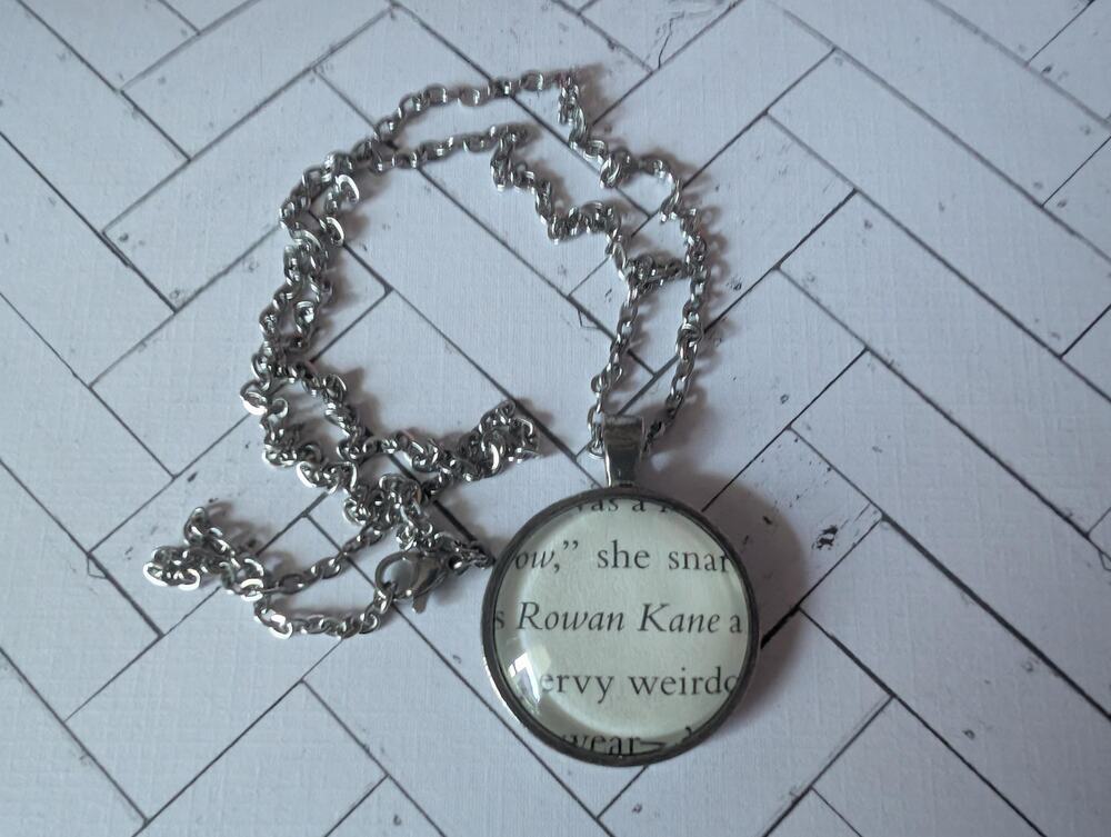 Rowan Kane pendant necklace made with Butcher and Blackbird book pages